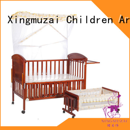 wooden cot with mosquito net