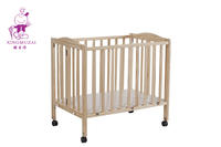 Adjustable pink wooden baby bed